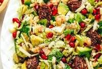 Vibrant Brussels Sprout Arugula Salad with Pomegranate and Parmesan