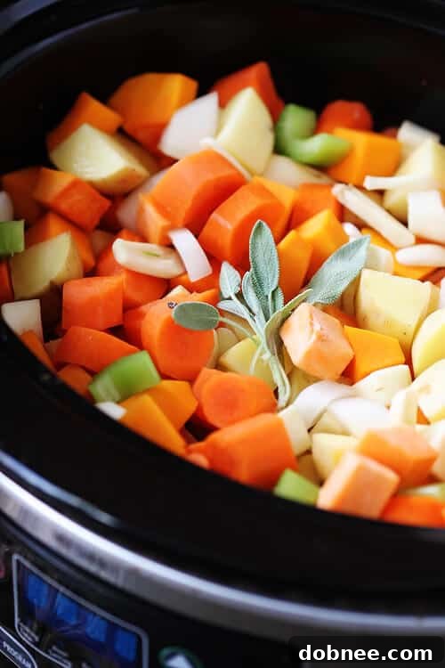 Close-up of a bowl of Slow Cooker Root Vegetable Stew, showcasing the vibrant colors and tender texture of the vegetables, ready to be served.