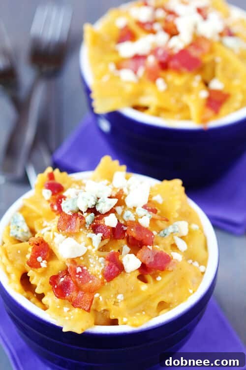 Close-up of creamy Butternut Squash, Bacon & Blue Cheese Macaroni & Cheese in a serving bowl.