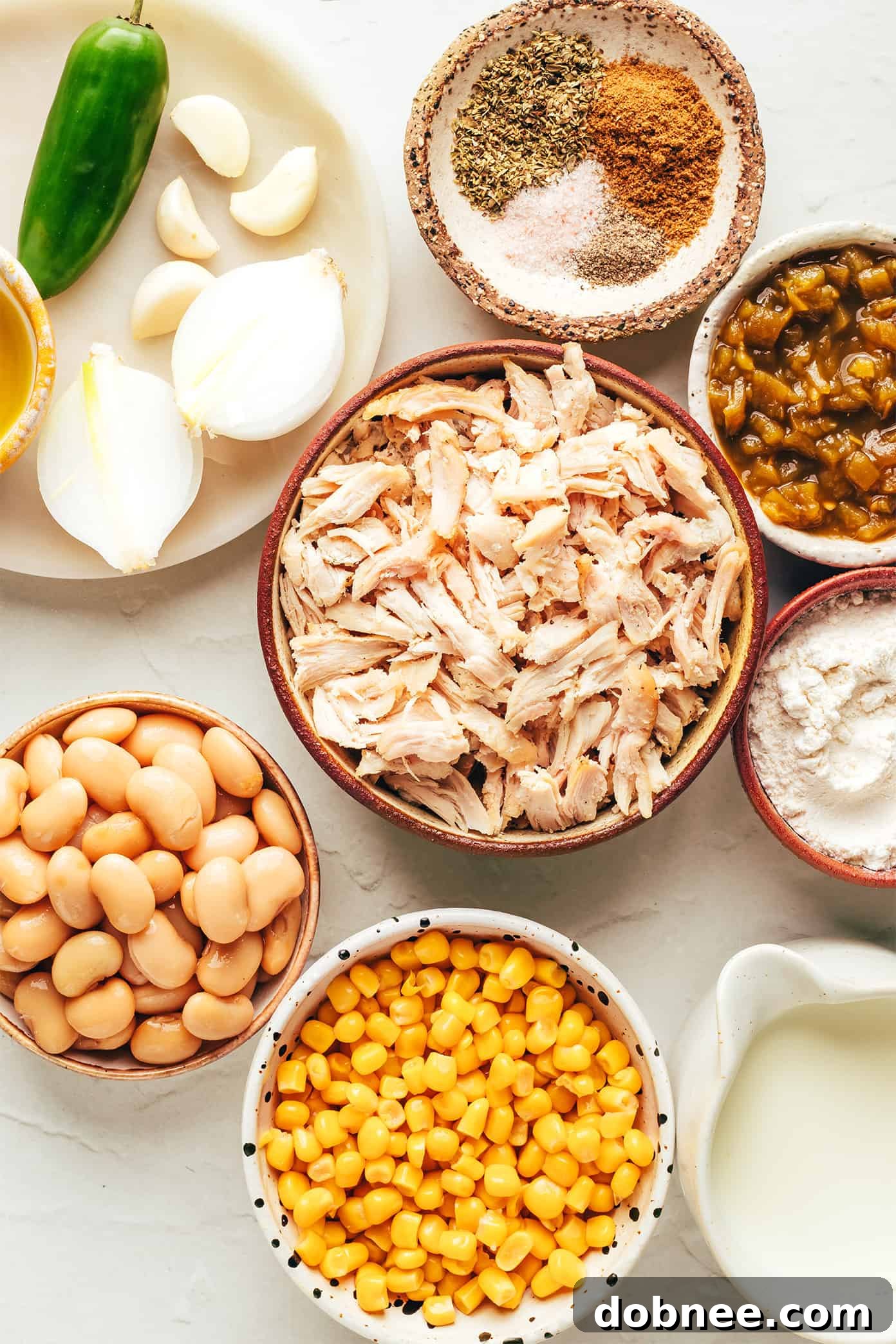 Close-up shot of creamy white chicken chili simmering in a pot, showcasing its rich texture.
