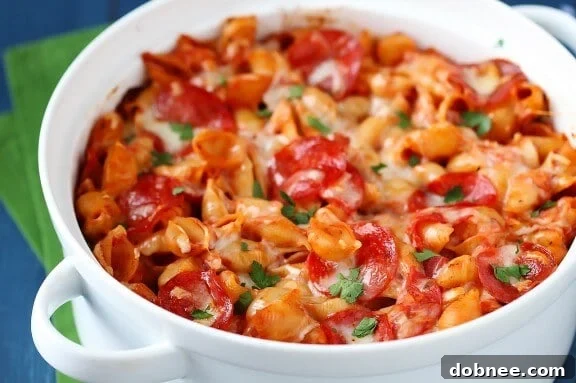 Close-up of a bubbling Pepperoni Pasta Bake with melted cheese and pepperoni, ready to be served.
