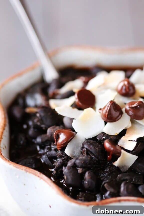 Velvet Black Bean Chili With Chocolate and Coconut 3 Hearty vegetarian Black Bean Chili with a vibrant garnish of toasted coconut and chocolate chips