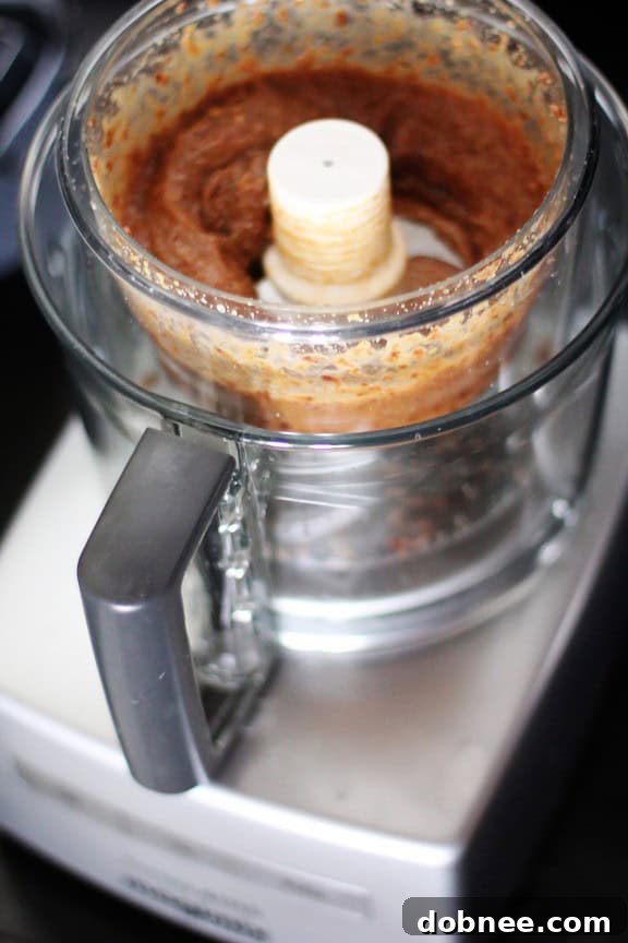 Magimix Food Processor for Energy Bites A Magimix food processor, used for making energy bites, on a kitchen counter.