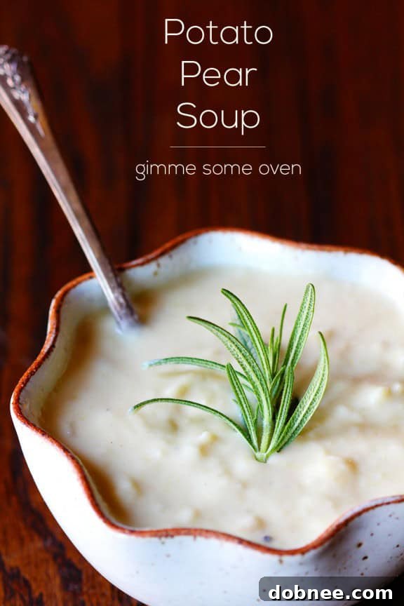 Close-up of Potato Pear Soup in a bowl, showing creamy texture and rosemary garnish