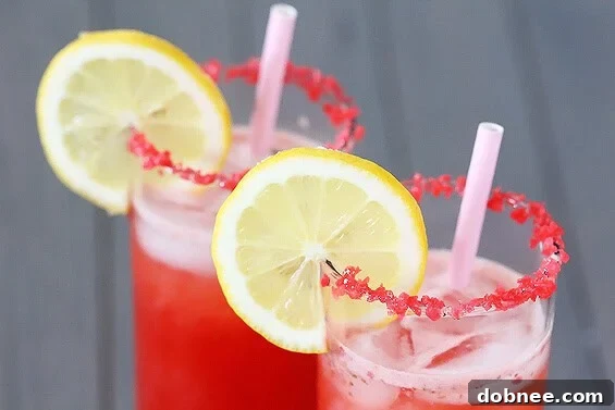 Refreshing Sparkling Strawberry Lemonade, garnished with fun Pop Rocks.
