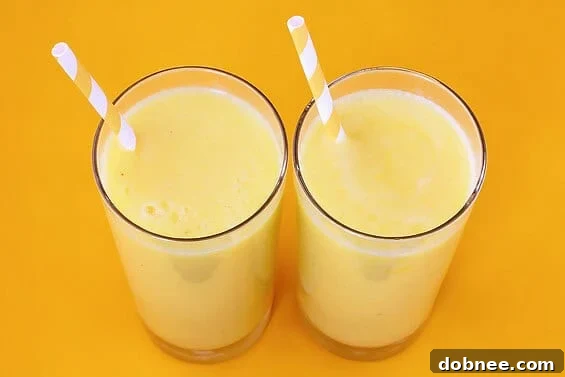 Pineapple, Banana & Coconut Smoothie | gimmesomeoven.com Tropical Yellow Smoothie featuring Pineapple, Banana, and Coconut Milk