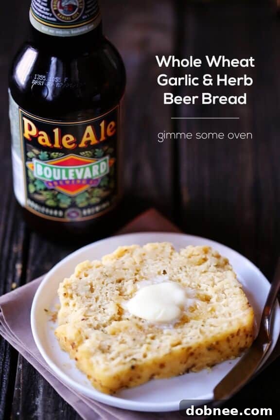 The Whole Wheat Garlic & Herb Beer Bread cooling on a wire rack after baking.