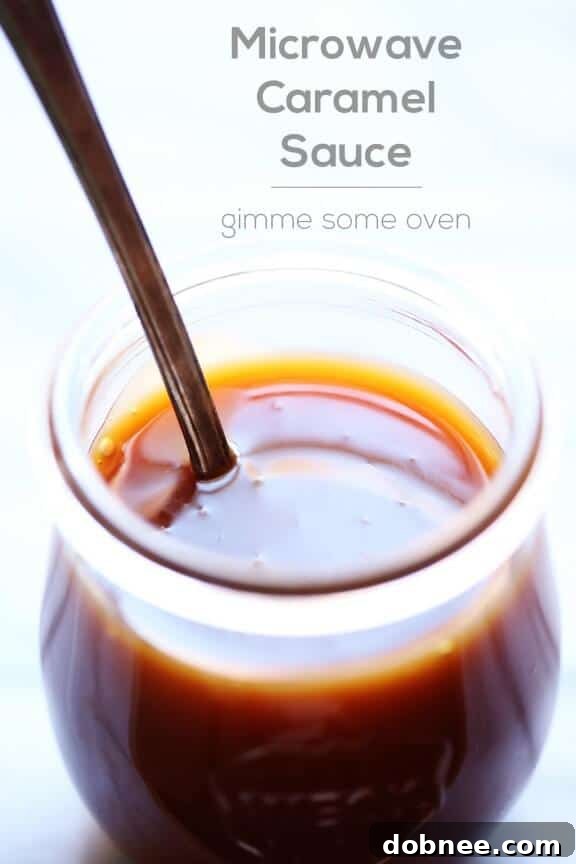 Close-up of Microwave Caramel Sauce poured over a spoon, showing its thick and gooey texture
