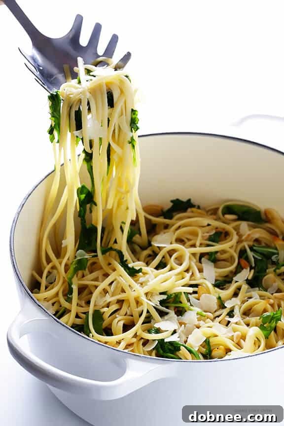 Linguine with Arugula, Garlic, and Parmesan served in a bowl, ready to eat
