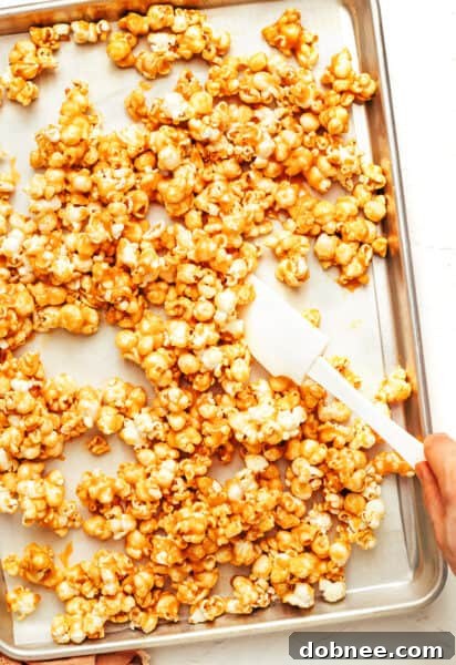 A large bowl of golden, crunchy caramel corn.