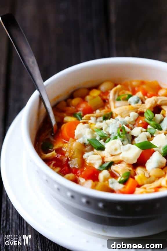 Close-up shot of Buffalo Chicken Chili served in a bowl, showing texture and toppings