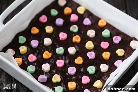 Close-up of baked Conversation Heart Brownies with pink and white candies