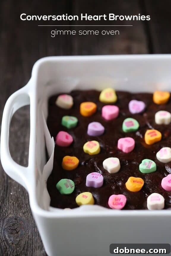 Overhead view of Conversation Heart Brownies in a pan, colorful and festive