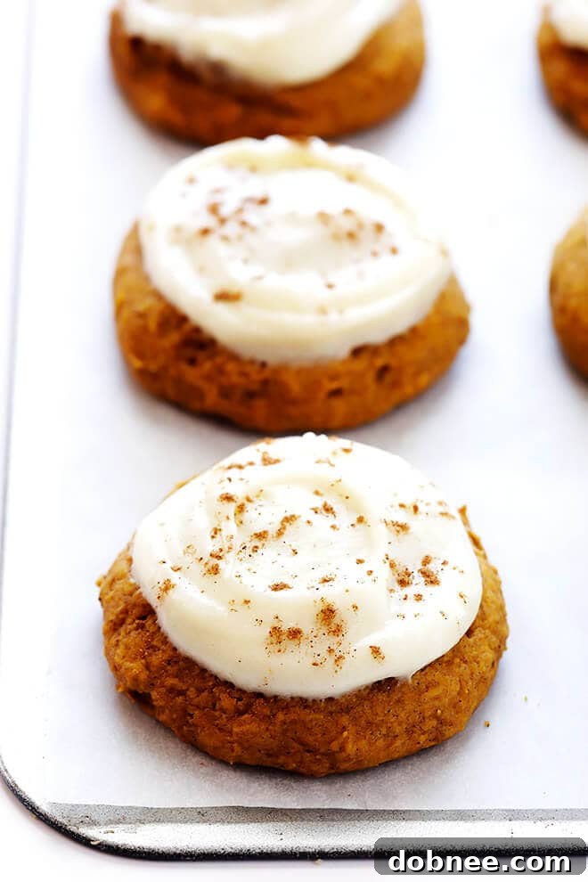 Smooth and creamy homemade cream cheese frosting, ready to be spread onto the freshly baked pumpkin cookies.