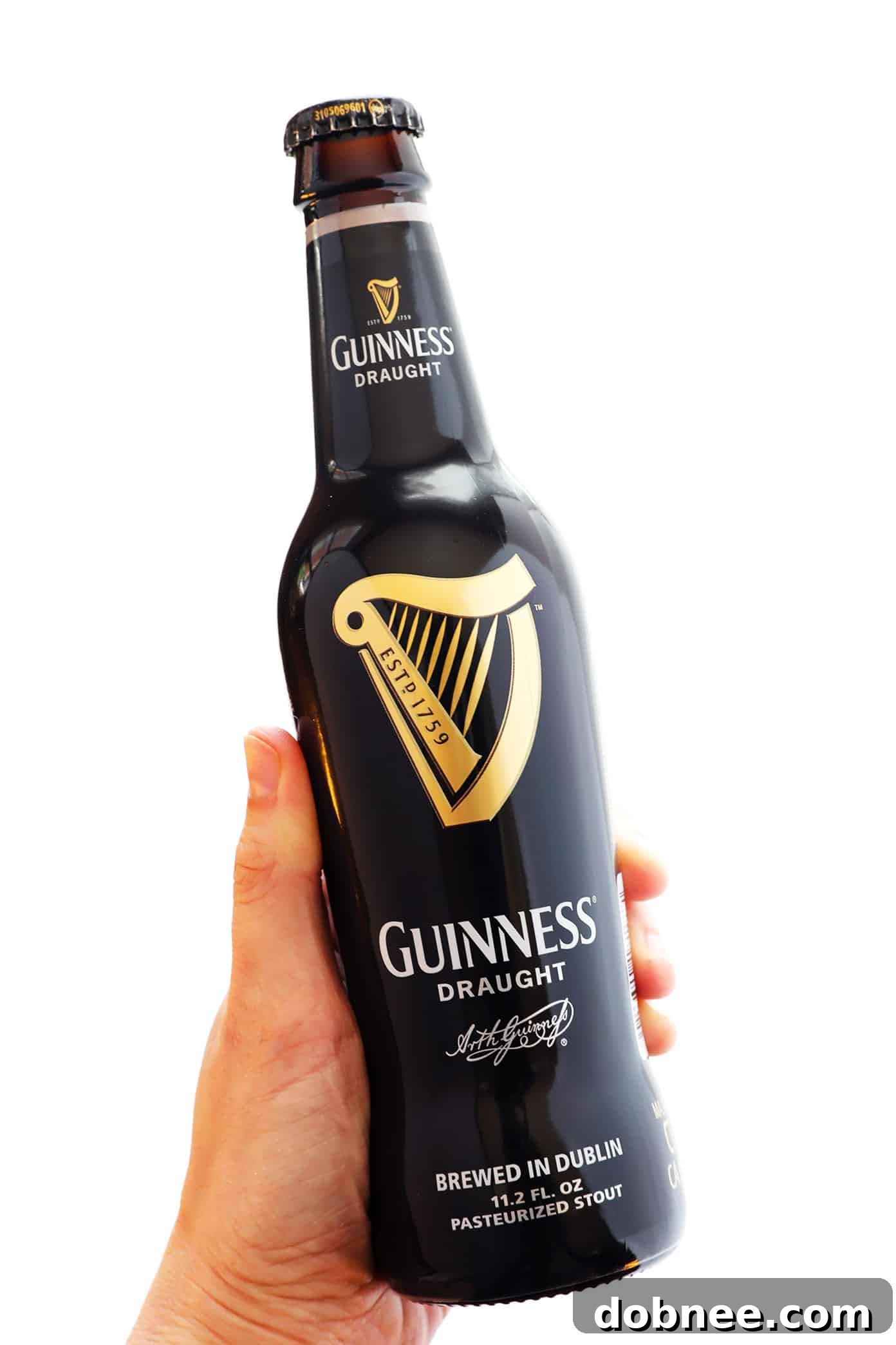 Bottle of Guinness beer next to ingredients