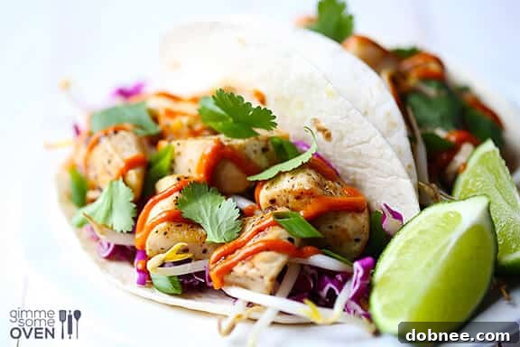 Delicious Thai Chicken Tacos with a vibrant peanut sauce and fresh toppings