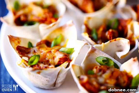 A tray of fresh chicken enchilada cups, ready to serve
