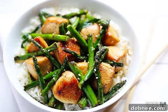 Delicious Chicken and Asparagus Stir-Fry served with rice