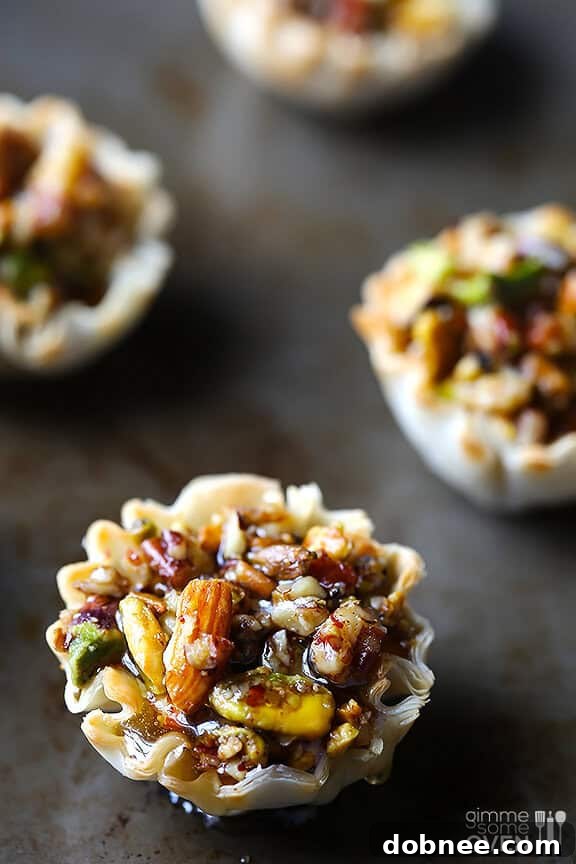 Close-up shot of Baklava Cups with generous honey drizzle, ready to be eaten