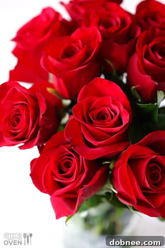 Rose Cake layered with creamy rose buttercream and fresh petals, ready to be served