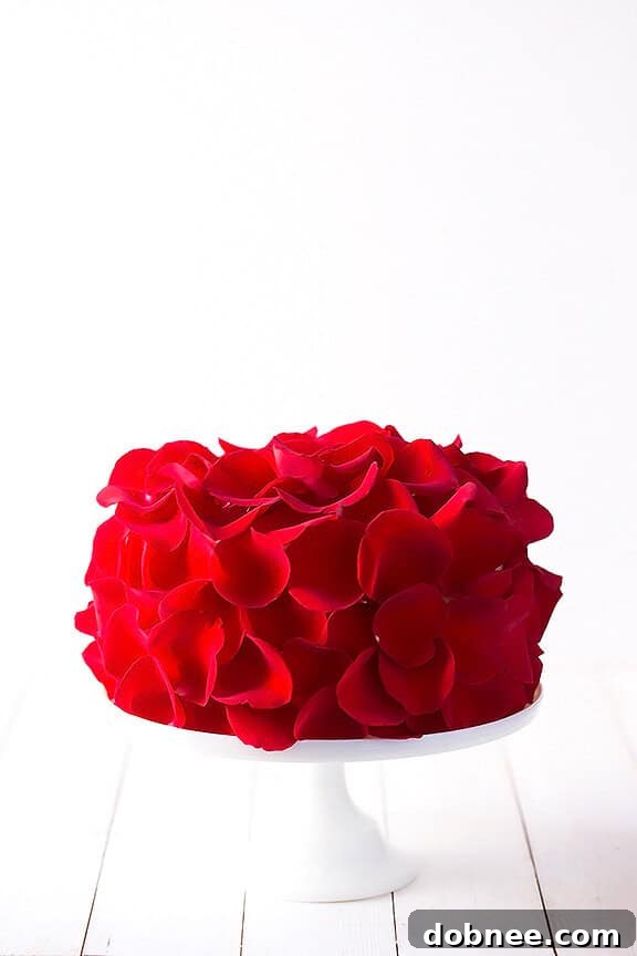 Side view of the exquisitely decorated Rose Cake, showcasing its beautiful layers and floral embellishments