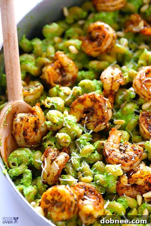 Asparagus-Spinach Pesto Pasta with Blackened Shrimp Recipe Vibrant Asparagus-Spinach Pesto Pasta with Succulent Blackened Shrimp - A seasonal comfort food recipe for any occasion.