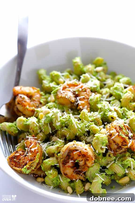 Asparagus-Spinach Pesto Pasta - Final Dish Overhead shot of Asparagus-Spinach Pesto Pasta with Blackened Shrimp in a serving bowl.