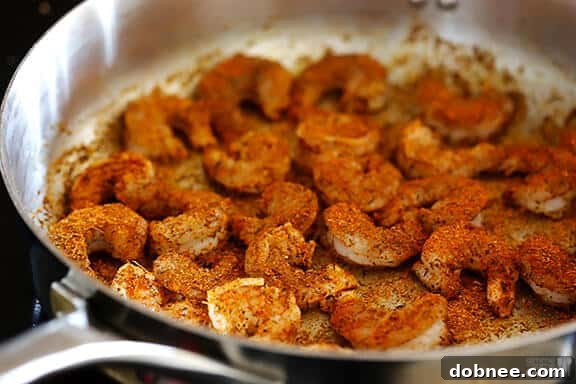 Blackened Shrimp Preparation Shrimp generously coated in blackening seasoning, ready for cooking.