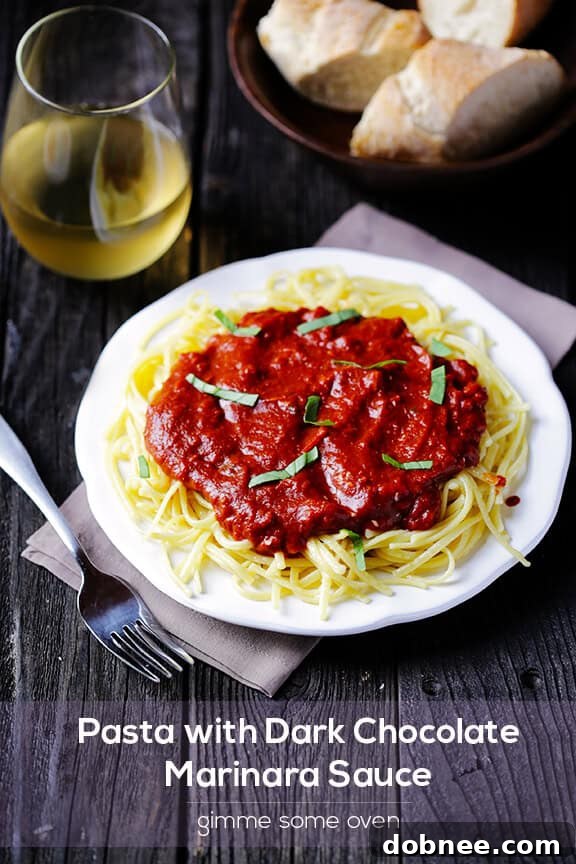 Overhead shot of a pot of Dark Chocolate Marinara Sauce simmering on the stove.