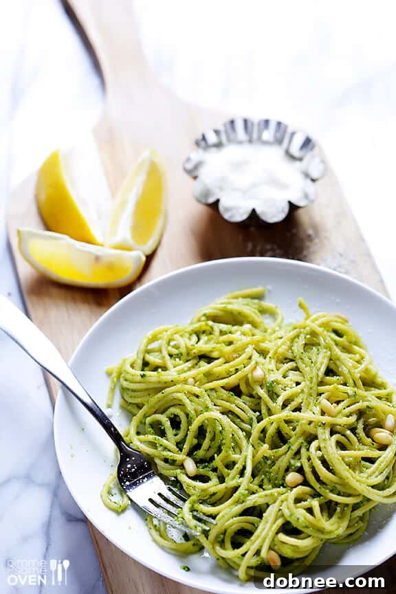 Close-up of pesto being drizzled with olive oil