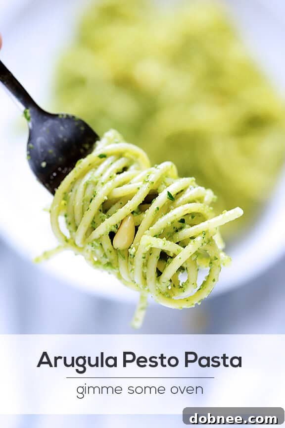 Arugula Pesto Pasta on a fork, ready to eat