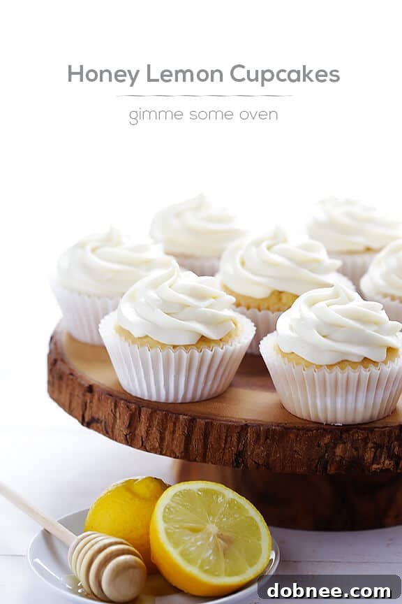 A close-up of a perfectly frosted Honey Lemon Cupcake, highlighting the texture and detail.