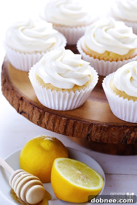 A tray of freshly baked Honey Lemon Cupcakes, ready to be served at a summer gathering.