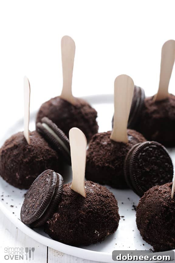 A close-up shot of Oreo Ice Cream Truffles on sticks, ready to be enjoyed