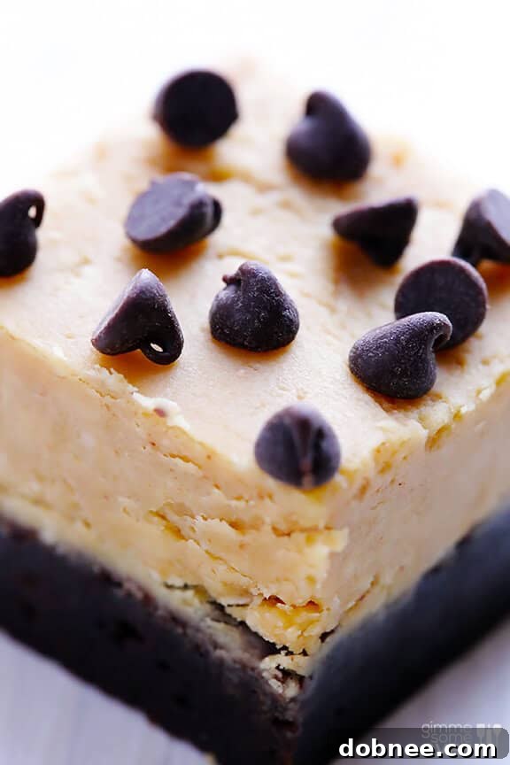 Hand holding a Peanut Butter Fudge Brownie with a dreamy background