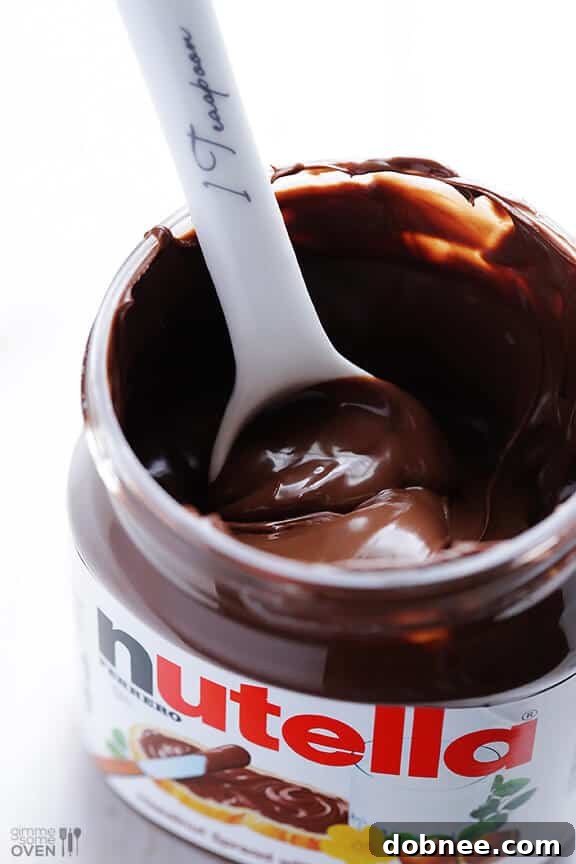 Decadent Nutella Cupcakes 3 Nutella Jar and a Stack of Cupcakes