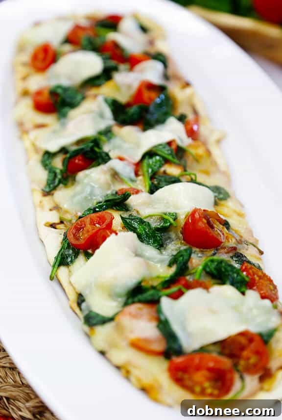 Summer-Inspired Roasted Tomato, Spinach, and Parmesan Flatbread | gimmesomeoven.com