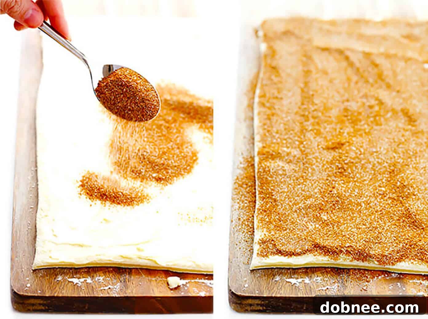 Generously sprinkling cinnamon-sugar mixture over the buttered cinnamon roll dough