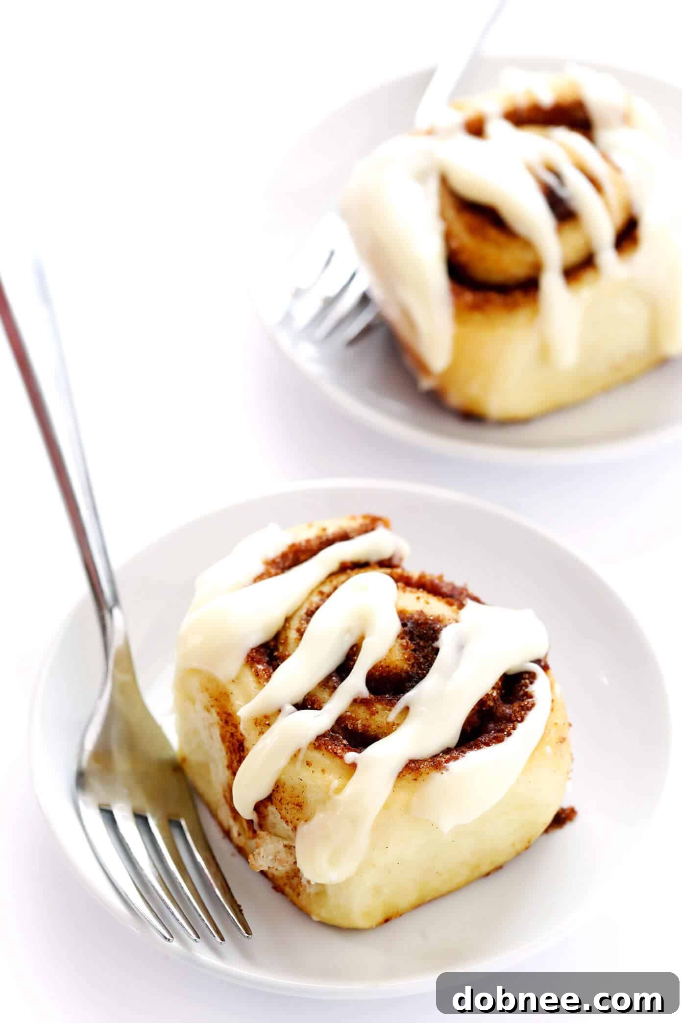 Luscious 1-Hour Cinnamon Rolls generously covered with creamy cream cheese icing