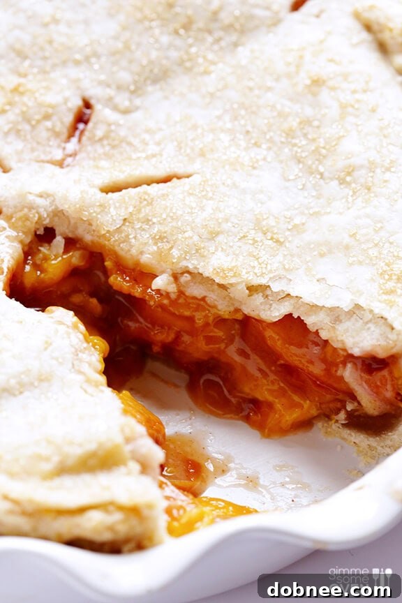 Warm peach bourbon pie filling bubbling after baking