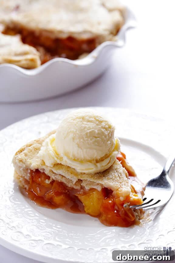 Two hands reaching for a slice of freshly baked Peach Bourbon Pie