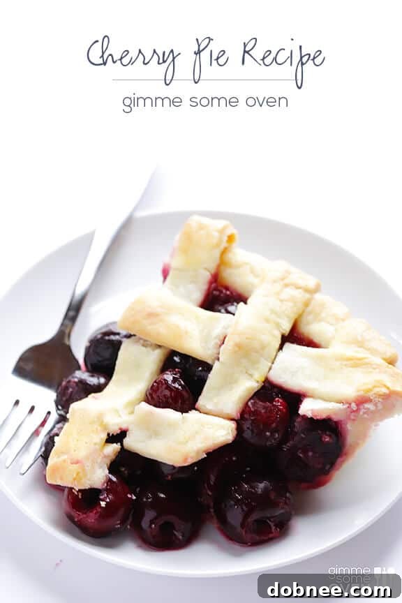 Entire sweet cherry pie on a cooling rack, freshly baked with a perfect golden crust