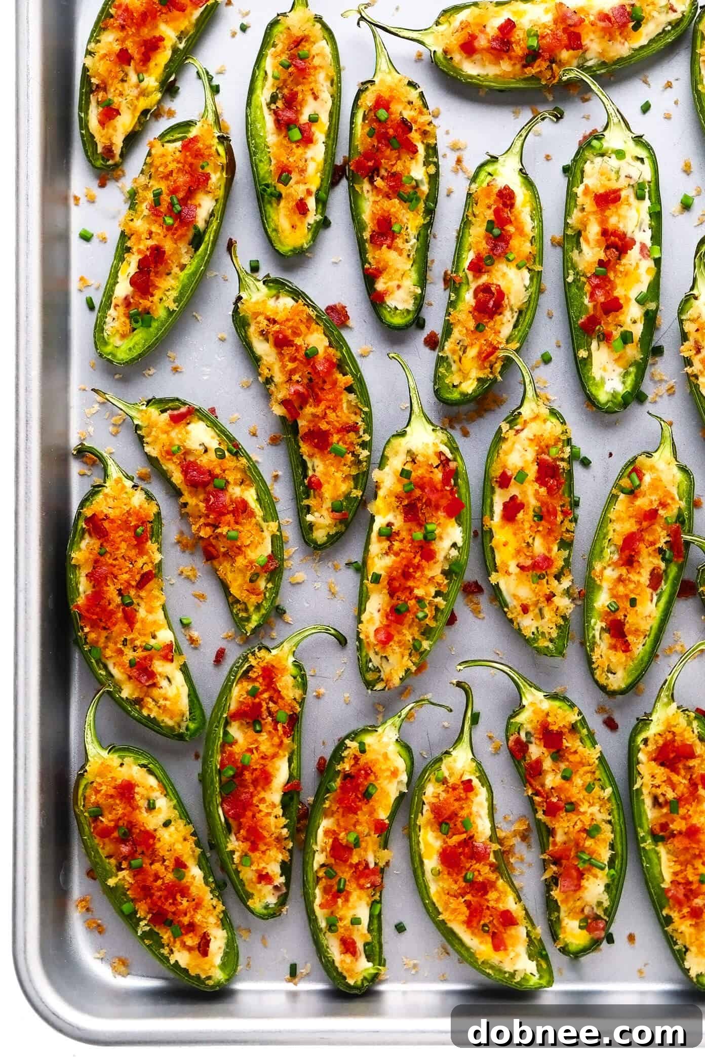 Baked Jalapeño Poppers on a baking sheet, fresh out of the oven.