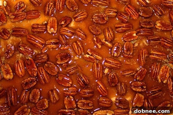 English Toffee Bars ready for the oven, showcasing the pecan and toffee topping