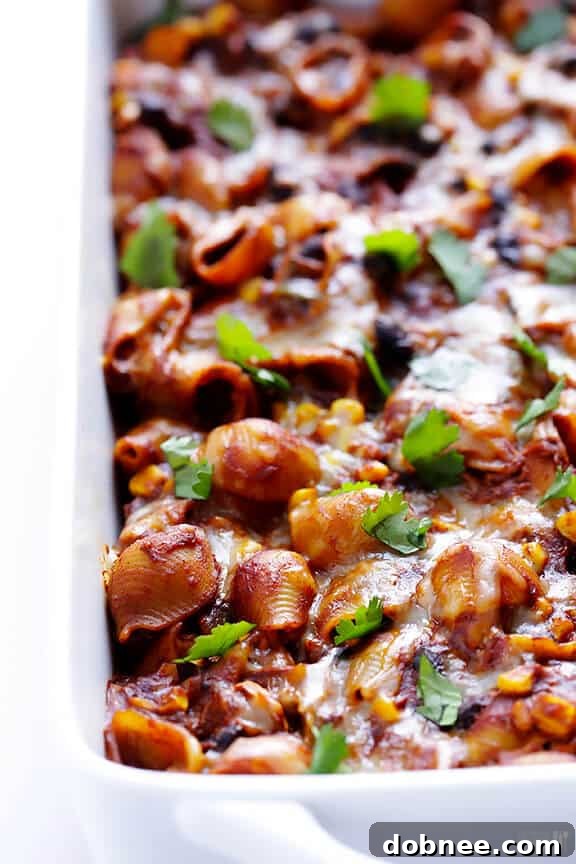 Chicken Enchilada Pasta Bake served directly in a baking dish, ready for family style serving