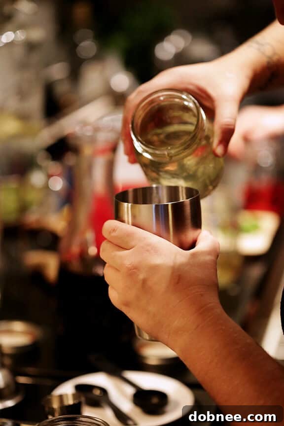 Friends enjoying a DIY mocktails party, creating their own drinks.