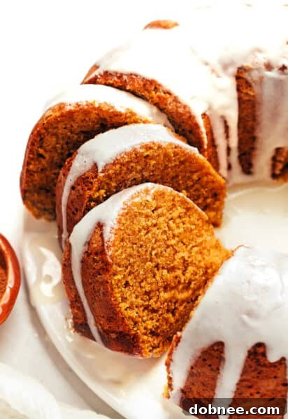 A delicious slice of pumpkin spice cake with cream cheese glaze