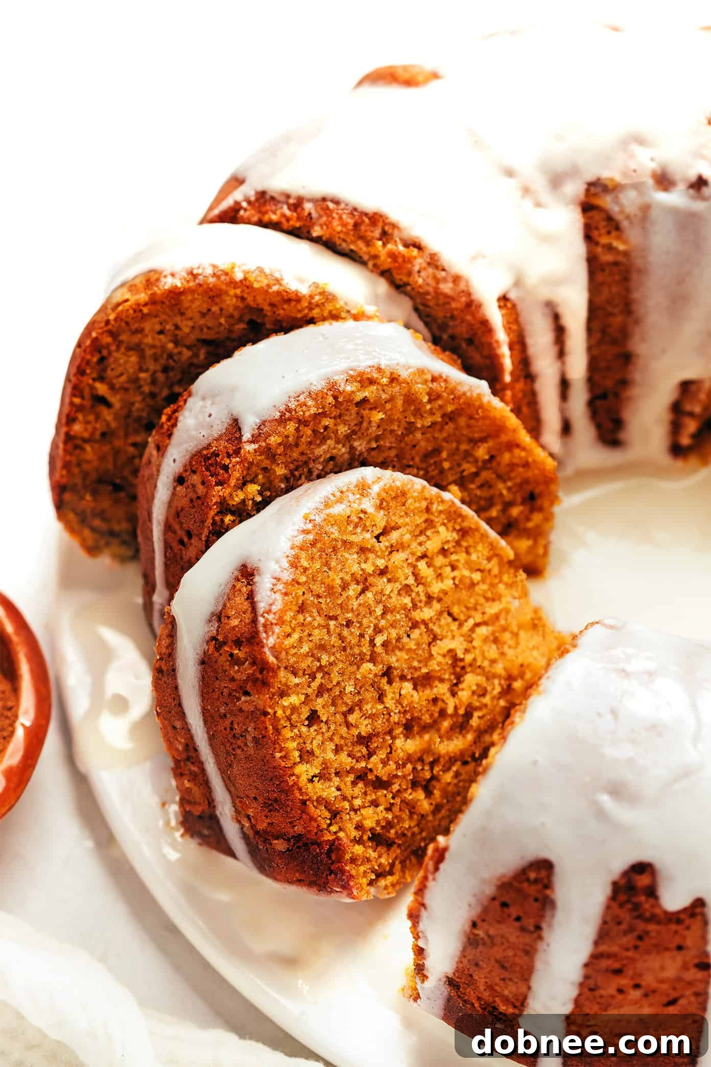 Perfectly sliced pumpkin spice cake ready to be served