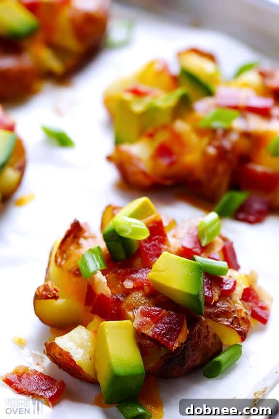 Close-up of a single loaded smashed red potato