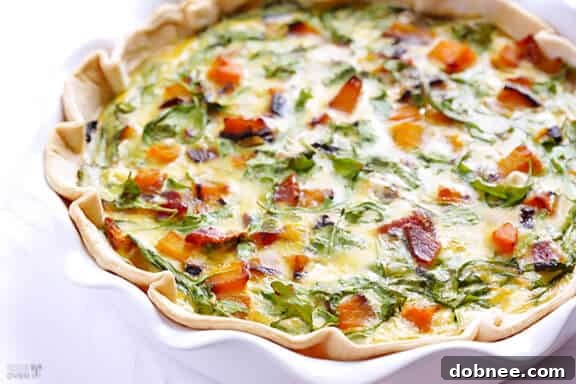 Delicious Butternut Squash, Arugula, and Bacon Quiche, perfect for breakfast or brunch